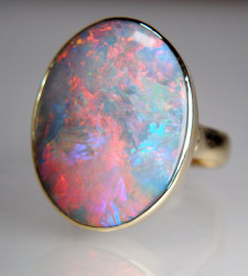 Black opal ring in 18ct yellow gold