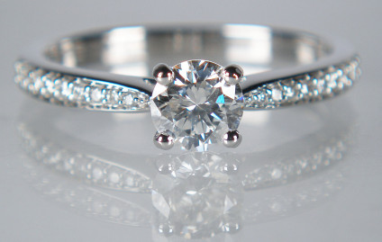 0.57ct diamond solitaire ring in 18ct white gold - 0.45ct (5mm round) brilliant cut diamond G colour SI1 clarity, claw set in an 18ct white gold ring with pave set diamond shoulders. Total diamond weight is 0.57ct. Exquisite ring and exceptional value.