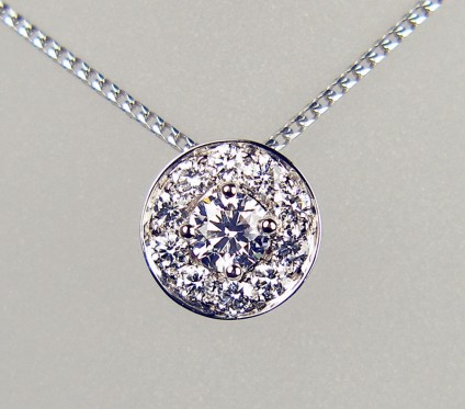 Diamond slider pendant in 18ct white gold - 0.78ct of round brilliant cut diamonds of G colour SI clarity mounted in 18ct white gold and suspended from an 18ct white gold 16" chain.  Beautiful, simple and super sparkly. Pendant is 10.5mm in diameter.