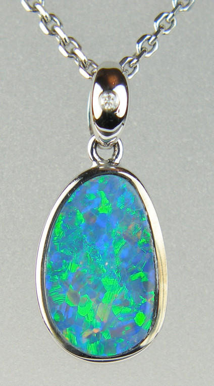 Opal doublet pendant with diamond in 14ct white gold - 1.60ct opal doublet pendamt with 0.01ct diamond in 14ct white gold. Pendant only, various chains available to buy separately.