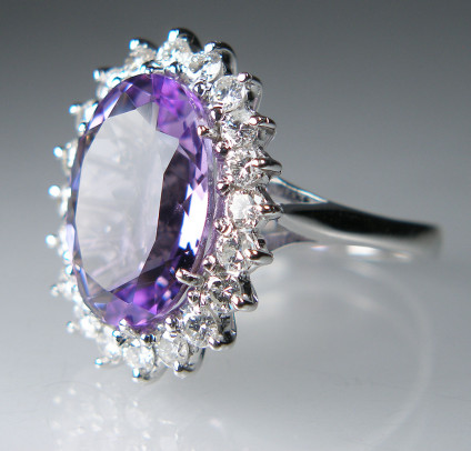 Amethyst & diamond cluster ring in 18ct white gold - 11x15mm oval amethyst in mid to light purple, surrounded with a halo of 22 x 2mm round brilliant cut diamonds in H colour VS clarity totalling 0.5ct, set in an 18ct white gold ring. This ring is pre-loved, but is good as new, hence the very modest sale price. Hurray to buy, when it is gone, it is gone!