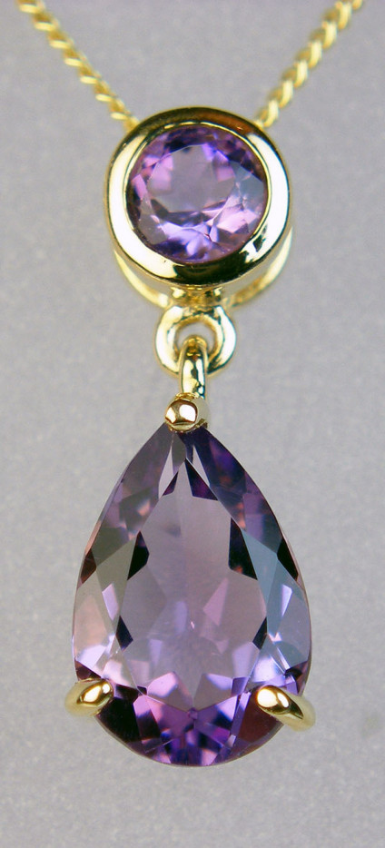 Amethyst pendant - amethyst pear drop and round rubover set amethyst pendant in 9ct yellow gold suspended from 18" 9ct yellow gold chain