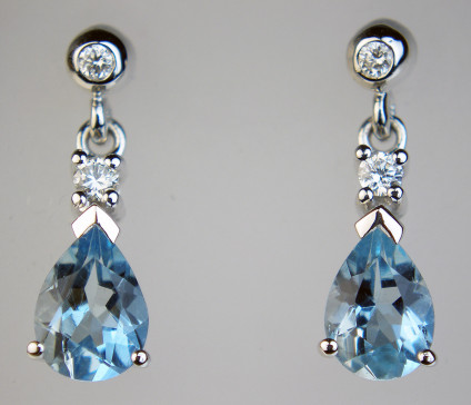Aquamarine & diamond eardrops in white gold - Pear cut aquamarines totalling 1.12ct set with 0.10ct of round brilliant white diamonds in 9ct white gold. Eardrops are 16mm long.
