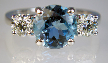 Aquamarine & diamond ring in 18ct white gold - Exquisite deep blue 2.26ct aquamarine flanked by a 0.80ct matched pair of round brilliant cut diamonds in H colour SI2 clarity, mounted as a ring in 18ct white gold