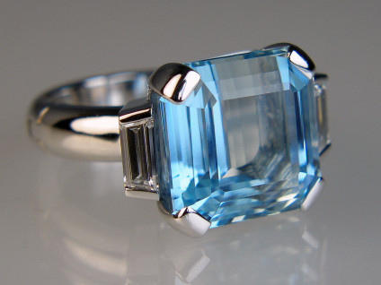 Aquamarine & diamond ring in 14ct white gold - Magnificent 11.23ct step cut aquamarine, cut in Idar Oberstein, and set with a 0.54ct matched pair of tapered baguette cut diamonds G colour VS clarity and mounted in an opening ring shank supplied by Fingermate of Florida, USA, all metalwork 14ct white gold