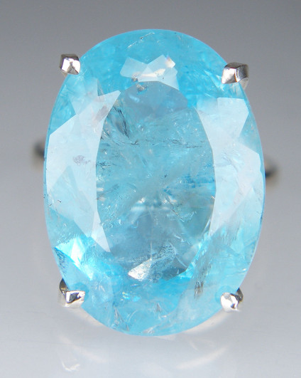 Huge oval aquamarine ring in silver - 21 x 15mm faceted blue aquamarine, full of interesting inclusions and all the more beautiful for that, set in a simple four claw silver ring. This ring is for special occasion wear only and is sure to attract alot of attention. Aquamarine is from Minas Gerais, brazil.