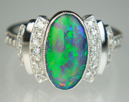 Black opal & diamond ring in platinum - Stunning vintage black opal cabochon weighing approximately 2ct and set with 0.33ct of diamonds, mounted in platinum. This pre-loved ring has been carefully inspected by our gemmologist and goldsmith and comes with a six month Just Gems warranty.