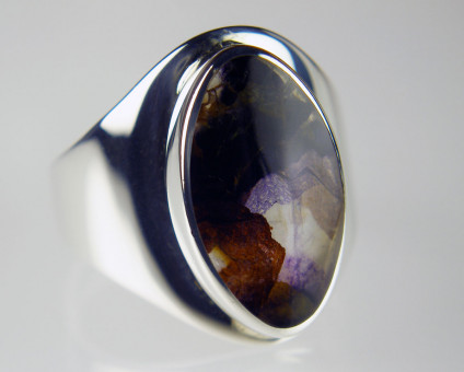 Blue John ring in silver - Derbyshire fluorspar also known as Blue John, set in silver. The Blue John has a slice of mother of pearl set behind it to improve its light reflectance.