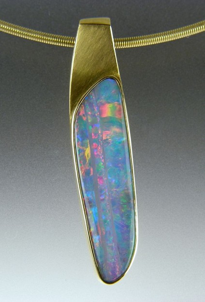 Boulder Opal Pendant in 18ct yellow gold - Boulder opal pendant in 18ct yellow gold. 9x40mm.
