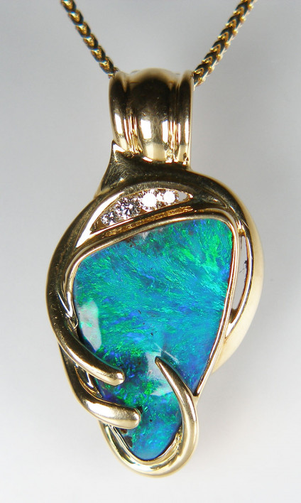 Boulder opal & diamond pendant in 18ct yellow gold - Unique boulder opal pendnat in 18ct yellow gold with diamond accents. Pendant is 32mm long and 18mm wide.