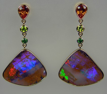 Boulder opal, orange & green garnet earrings in 18ct yellow gold - Exceptional matched pair of boulder opals weighing 31.77ct, from Queensland, Australia, set with 2.34ct spessartine orange garnet trillion pair and 0.40ct tsavorite garnet round pair in pale green and a 0.19ct pair of tsavorite garnets in an intense green. All mounted in 18ct yellow gold.  The finest earrings we have ever made! They are 42mm long. 