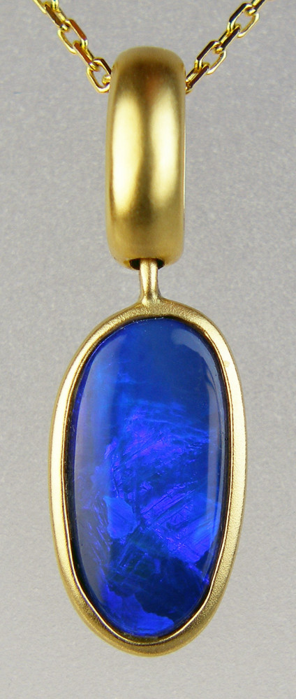 Opal doublet pendant in 18ct yellow gold - bright royal blue opal doublet mounted in satin finished 18ct yellow gold pendant. Pendant only, chains available to purchase separately. Pendant measures 24 x 8mm.