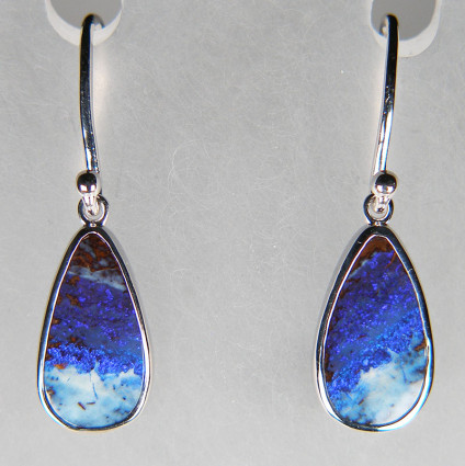 Boulder opal eardrops in silver - Pear shaped pair of blue and white boulder opals from Queensland, Australia, rubover set in silver and suspended from simple silver hooks. Opals weigh 6.06ct and are 10x15mm.