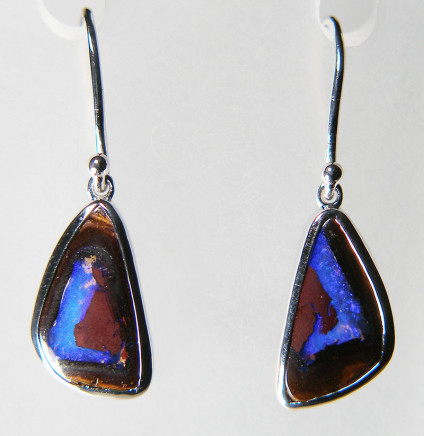 Boulder opal drop earrings in silver - 17.27ct pair of boulder opals from Queensland, Australia, rubover set in silver eardrops suspended from simple silver hooks. The opals are 10x17mm. 