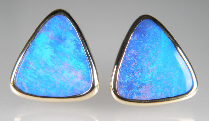 Boulder opal earstuds in 18ct yellow gold - Stunning vibrant bright blue and turquoise boulder opal earstuds, rubover set in 18ct yellow gold. Earstuds are triangular in shape with each side approximately 15.5mm. The boulder opals are from near Winton in Queensland, Australia.