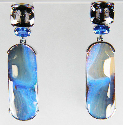 Boulder opal, sapphire & grey spinel earrings in 9ct white gold - Cartouche shaped boulder opal pair weighing 24.63ct and set with a 0.61ct oval blue sapphire pair and 3.06ct cushion cut grey spinel pair, claw set in 9ct white gold. These stunning earrings measure 9x35mm.
