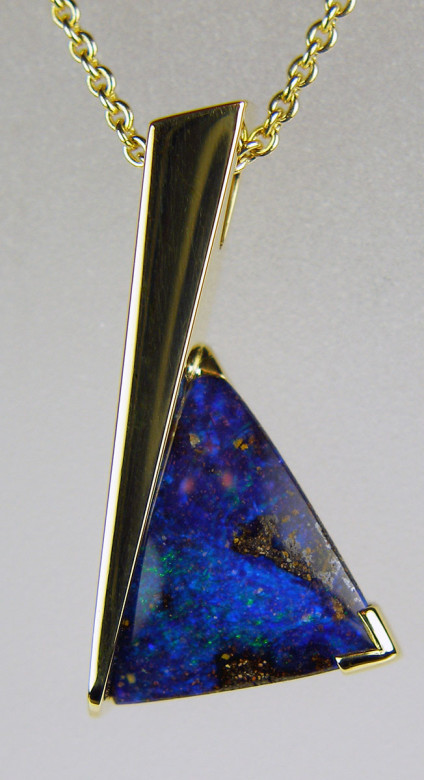 Boulder opal pendant in 18ct yellow gold - 1.93ct brilliant purple-blue boulder opal set in a handmade angular 18ct yellow gold pendant mount and suspended from a 21" adjustable fine trace chain in 18ct yellow gold 