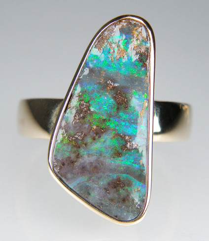 Boulder opal ring in 9ct yellow gold - 24 x 13mm boulder opal rubover set in 9ct yellow gold ring 