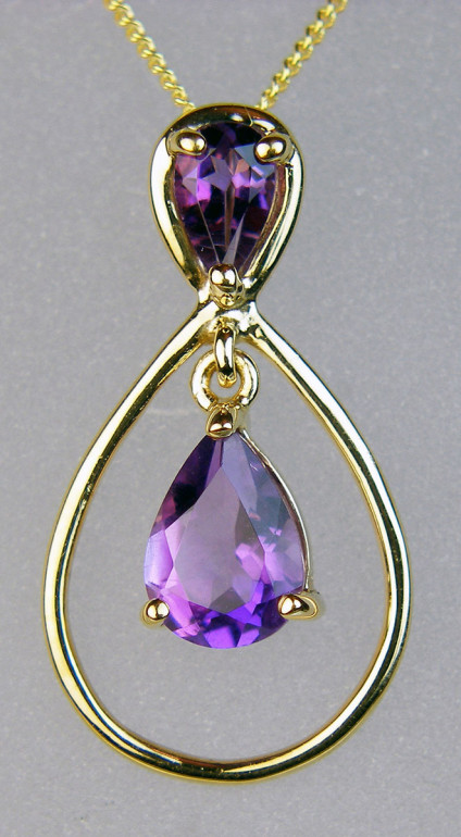 Amethyst double pear drop pendant - Amethyst double pear cut pendant set in 9ct yellow gold suspended from a 9ct yellow gold 18" chain