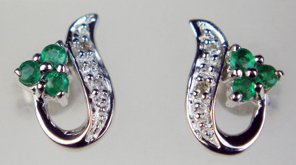 Emerald & diamond earstuds in 9ct white gold - Dainty earstuds set with 0.12ct emeralds & 1 point round brilliant cut diamonds in 9ct white gold. Earstuds are 10mm long and 7mm wide