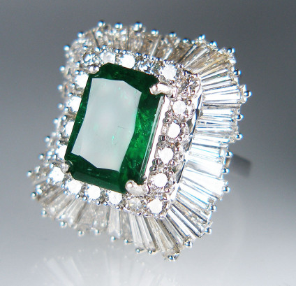 Zambian emerald & diamond ring in 18ct white gold - 5.18ct Zambian emerald set with at least 3.5ct of round brilliant & baguette cut diamonds in a spectacular 18ct white gold cocktail ring dating from the 1950s. 