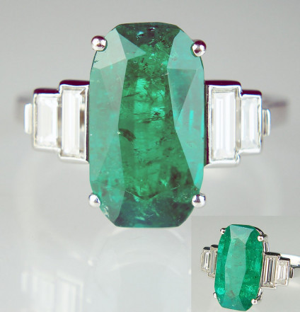Emerald & diamond ring in platinum - 4.5ct top colour emerald flanked by a 0.70ct double pair of baguette cut diamonds and mounted in platinum. An exceptional ring, this pre-loved item has been carefully inspected by our gemmologist and goldsmith and comes with a six month Just Gems warranty.