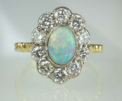 Opal & diamond ring - Estate piece. 0.75ct white opal set with 1.12ct diamonds in 18ct white & yellow gold.