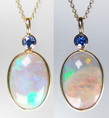 Sapphire & opal pendant in 18ct yellow gold - Unusual Ethiopian opal weighing 15.17ct which is so beautiful on both sides that we decided to set it in a swivel setting so that the wearer can choose which side to have front facing, depending on their preference as to colour. One side is very red, the other blue/green. Set with a 4.8mm round natural blue sapphire weighing 0.62ct. Both stones are rubover set in 18ct yellow gold. The pendant measures 48mm long and is 18mm wide. It is suspended from an 18" trace chain in 18ct which is available for separate purchase for £305.