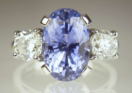 Sapphire & Diamond Ring - 7.9ct unheated oval Sri Lankan hyacinth blue sapphire set with 1.53ct pair of round brilliant cut diamonds (diamonds customer's own) in a handmade platinum ring