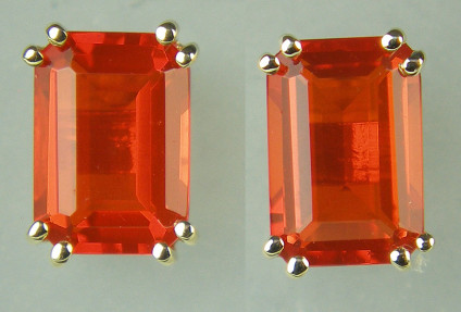 Fire opal emerald cut earstuds in 9ct yellow gold - 0.80ct pair of emerald cut fire opals in 9ct yellow gold earstuds. Earstuds are 6x4mm. Very vibrant orange colour.