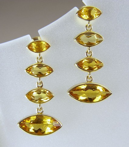 Golden beryl earrings in gold - Golden beryl earrings in 18ct yellow gold.  Each marquise cut golden beryl is bezel set and flexibly connected to form bright, light and brilliantly golden ear drops 33mm in length.
