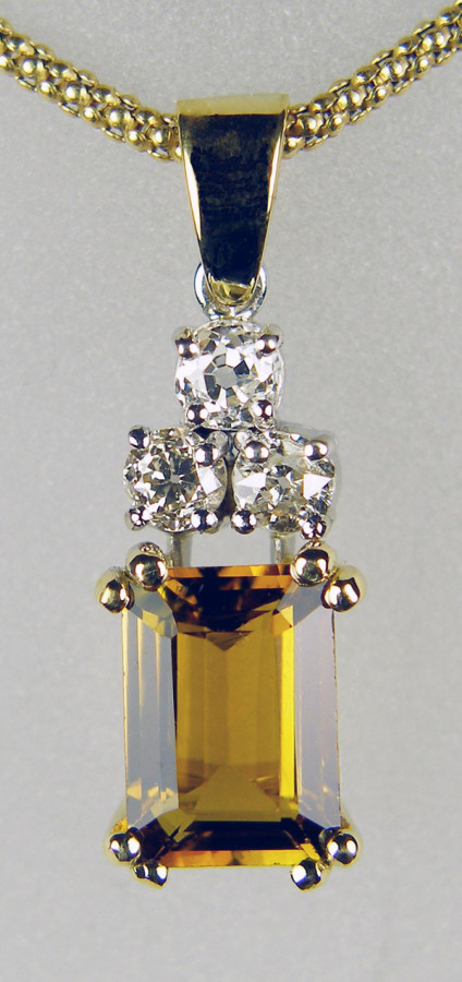 Tourmaline & old cut diamond pendant - 2.67ct emerald cut golden tourmaline set with a cluster of three old mine cut diamonds and mounted in 18ct yellow gold, suspended from an 18" 18ct yellow gold cable