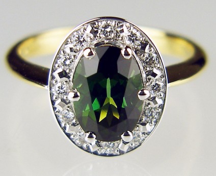 Tourmaline & diamond cluster ring - 1.62ct oval green tourmaline surrounded by 0.21ct of F colour VS clarity diamonds mounted in 18ct white and yellow gold