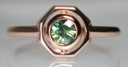 Green sapphire rubover ring in 18ct rose gold - Delicate ring in 18ct rose gold set with a 0.38ct round cut natural green sapphire from Kenya. The ring head is 8.2mm across. The ring size is M1/2 and can be resized. This design is a direct copy of a much-loved antique ring.