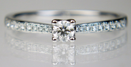 0.27ct diamond solitaire in platinum - Dainty but solidly made, diamond solitaire ring set with a G/VS 0.15ct round brilliant cut diamond with 12pts of diamonds set down the ring shoulders, all metalwork is in platinum. Top quality, exquisite, a perfect engagement ring. Pre-loved. Size Q.