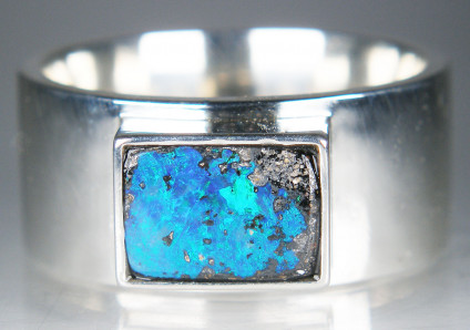 Man's boulder opal ring in silver - Bright blue Australian boulder opal rubover set into man's broad silver band