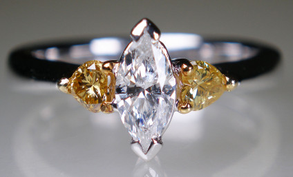 Marquise and heart cut diamond ring in platinum - 0.45ct marquise cut diamond flanked by a 0.45ct matched pair of heart cut natural yellow diamonds set in 18ct yellow gold with a platinum shank