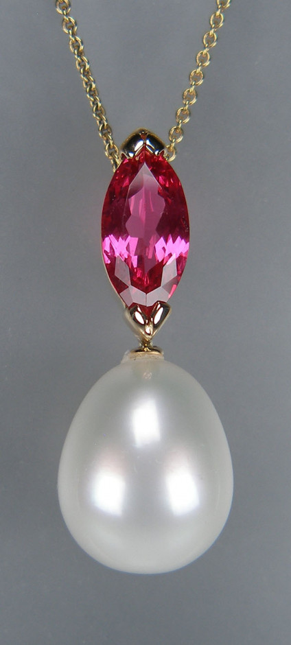 Mahenge spinel & south sea pearl pendnat in 18ct yellow gold - 2.17ct marquise cut natural pink spinel from Mahenge, Tanzania of exceptional clarity & brilliance set above an Australian South Sea cultured pearl drop measuring 12.5x15.1mm with excellent lustre. The pearl is supplied by Pearls of Australia of Cygnet Bay and is accompanied by a certificate of authenticity. The pendant is made in 18ct yellow gold and suspended from a 20” adjustable trace link chain in 18ct yellow gold.
