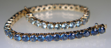 Montana sapphire bracelet in 14ct yellow gold - Beautiful shades of blue bracelet with 14.26ct round cut Montana sapphires, claw set in 14ct yellow gold bracelet with safety clasp.