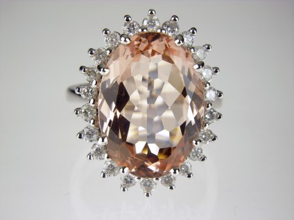 Morganite & Diamond Ring - Pink morganite oval surrounded by diamonds and mounted in 18ct white gold