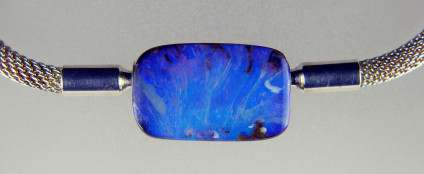 Boulder opal bead in silver cable - Boulder opal bead set in rose gold coloured silver cable. The bead is 18 x 11mm. The boulder opal is from Queensland, Australia.