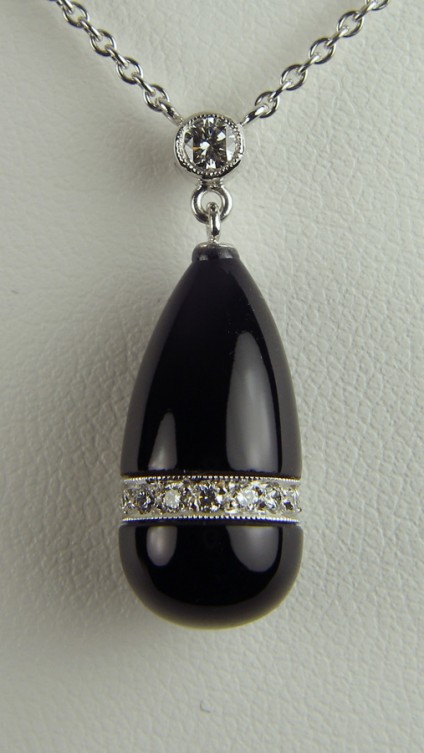 Black onyx and diamond pendant - Carved & polished black onyx pendant set with 0.24ct diamonds in 18ct white gold. SPECIAL SALE PRICE was £899 now £595.