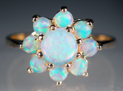 Round opal cluster ring in 9ct yellow gold - Simple flower shaped cluster of round natural turquoise blue Australian opals mounted in 9ct yellow gold
