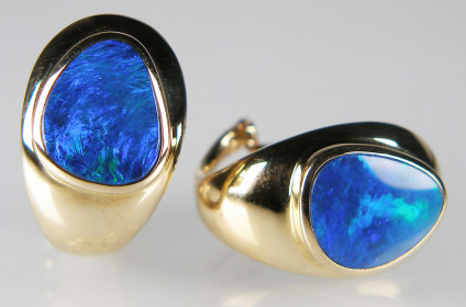 Bright blue opal doublets in clip & post style 14ct yellow gold earstuds - Impressive looking bright blue opal doublets rubover set in 14ct yellow gold post and clip earrings, measuring 11 x 19mm