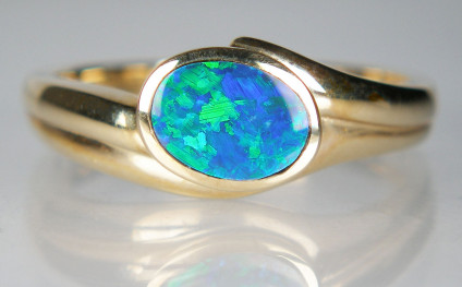 Opal doublet ring in 14ct yellow gold - Beautiful opal doublet rubover set in 14ct yellow gold ring