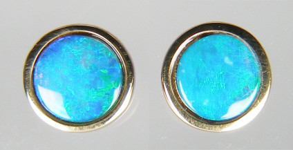 Round opal doublet earstuds in rubover 9ct yellow gold - 7mm round earstuds in 9ct yellow gold set with opal doublets in a bright turquoise blue colour