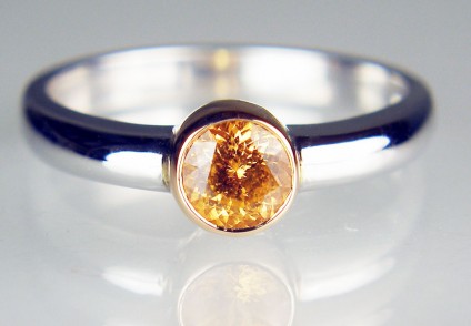 Mandarin garnet ring in rose & white gold - 4.7mm round, 0.55ct round brilliant cut orange (mandarin) garnet from Nigeria, set in 18ct rose gold rubover mount on 18ct white gold shank