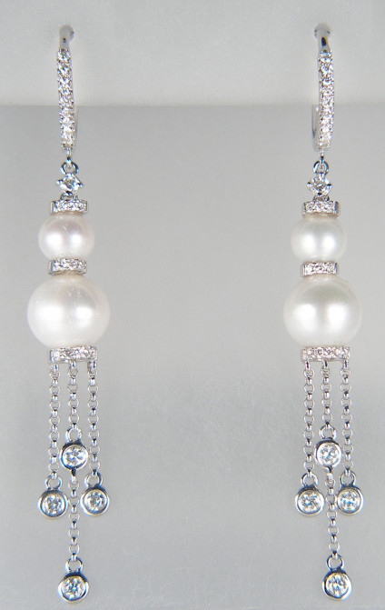 Diamond & culrued pearl eardrops in 18ct white gold - Delicate and sparkly eardrops measuring 5.7cm long, set with 0.55ct of round brilliant cut diamonds and four cultured white pearls in 18ct white gold. These earrings are included in our 20 year anniversary sale and now cost £585. They are the perfect earrings to wear with a wedding dress!
