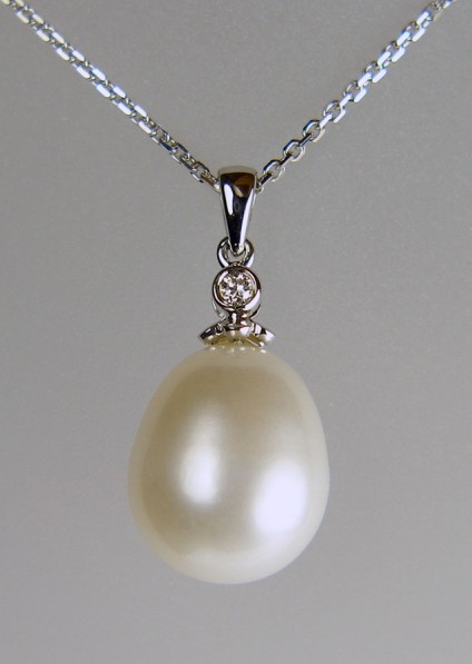 Pearl & diamond pendant with 8pt diamond - Beautiful drop shaped cultured pearl suspended from rubover set 8pt brilliant cut white diamond in 18ct white gold on an 18ct white gold fine cut trace chain 18"