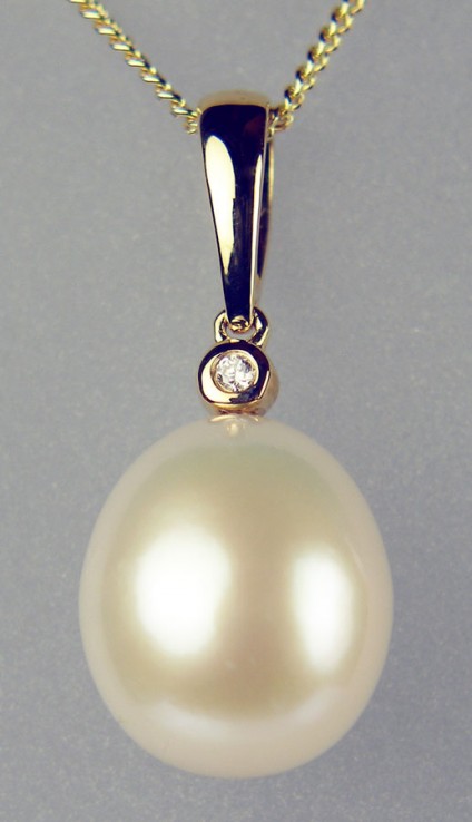Pearl & diamond drop pendant in gold - 10-13mm cultured pearl drop set with 8pt round brilliant cut diamond in 9ct yellow gold, suspended from 9ct yellow gold 18" chain